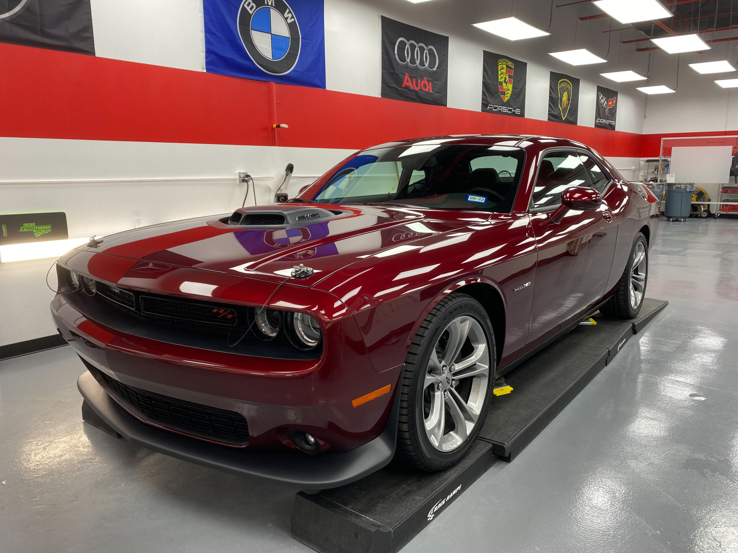 A maroon Dodge Challenger with Performance Clear Bra's Paint Protection Film installation.