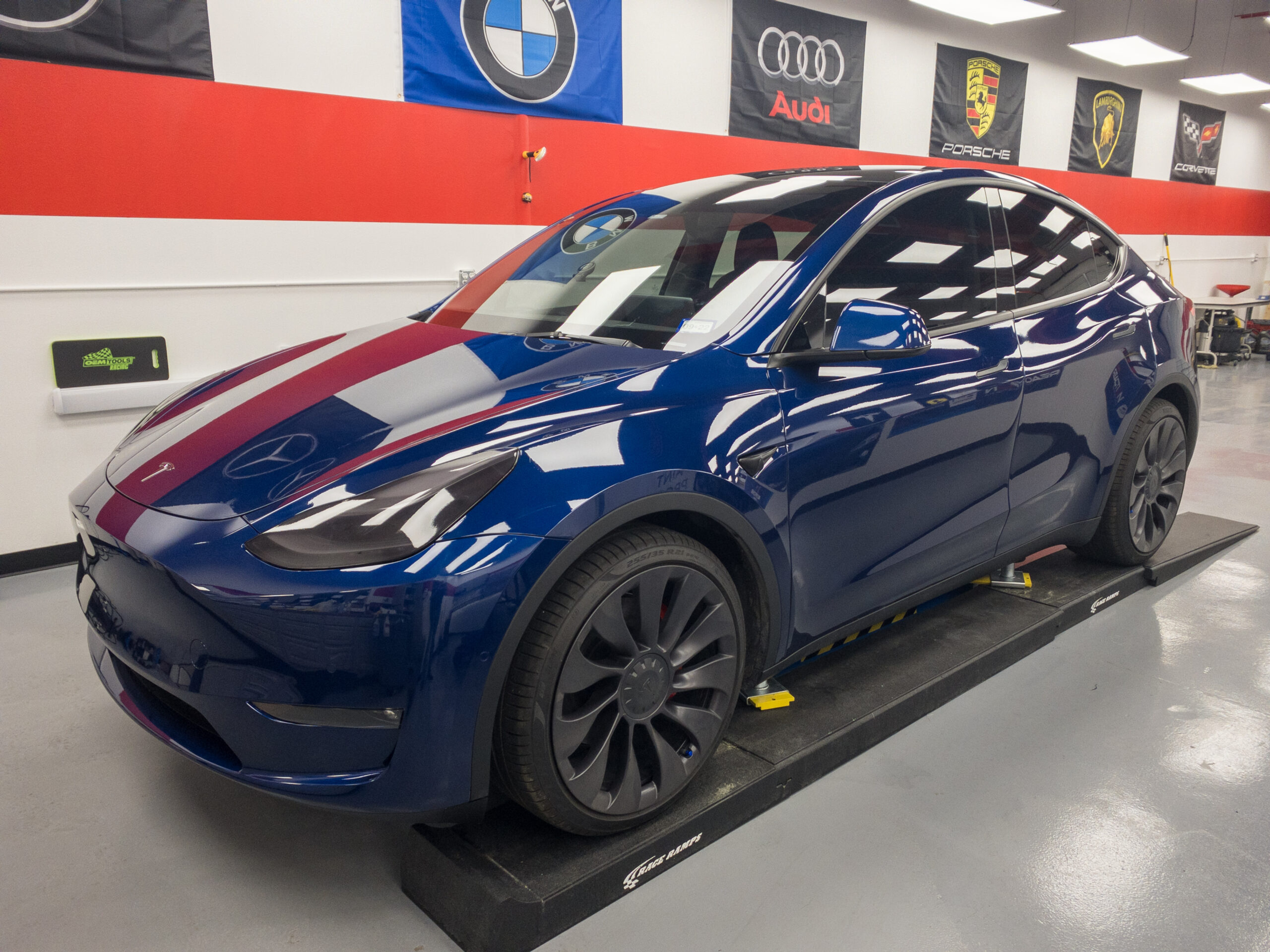 A blue Tesla Model Y with Performance Clear Bra's Paint Protection Film installation.